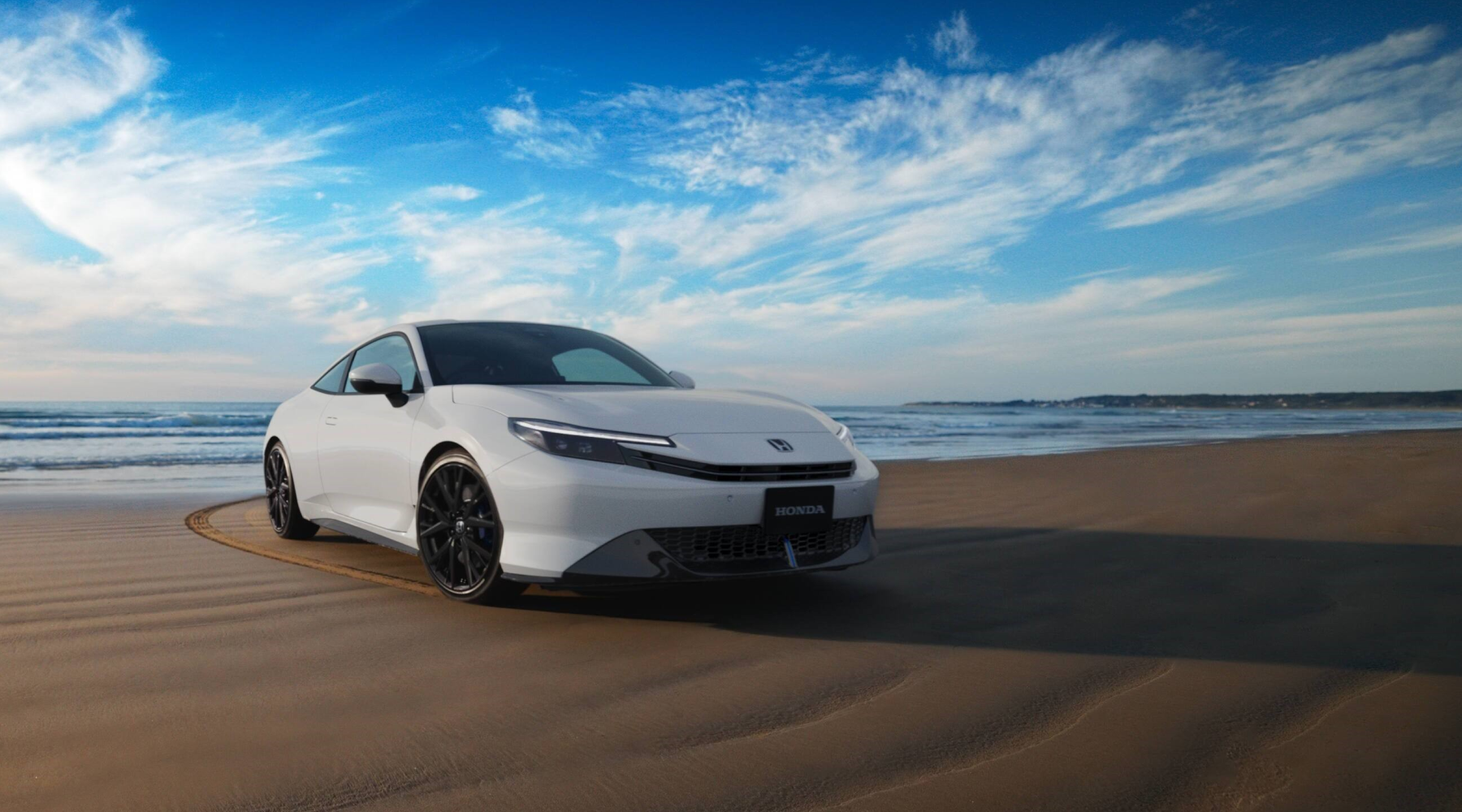 Vit Honda på strand